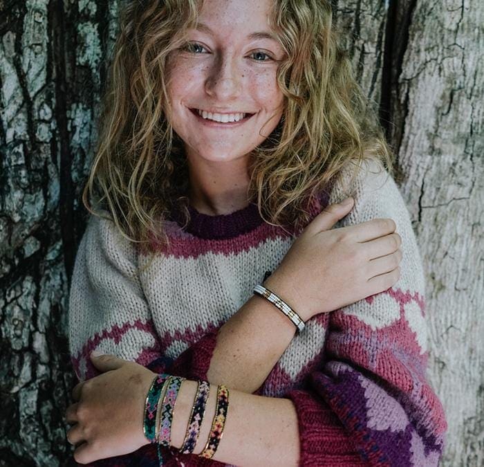A model wearing the Galaxy Bali Friendship Bracelet Bundle from Love Is Project