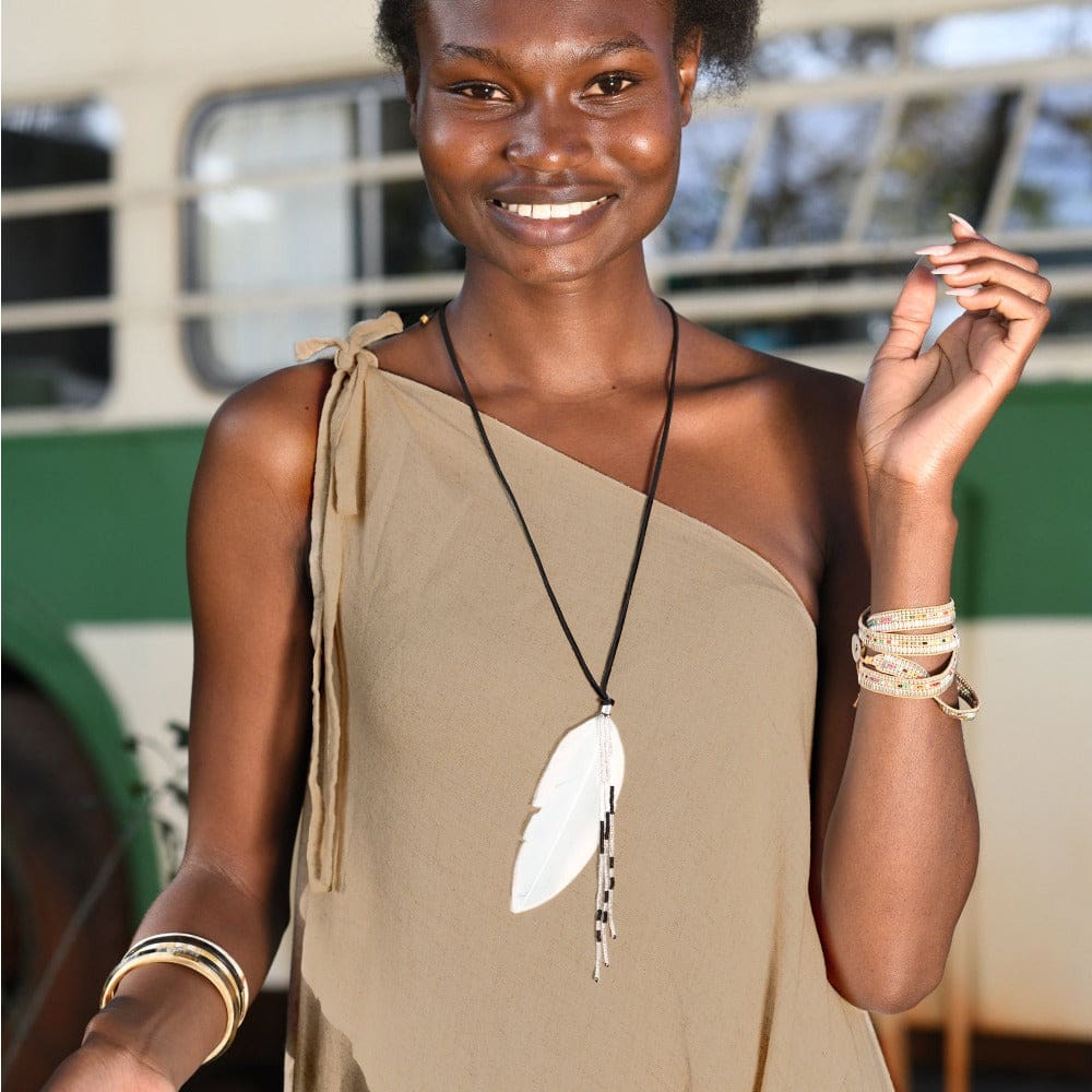 Feather Pendant Necklace with black suede necklace and black and white beads