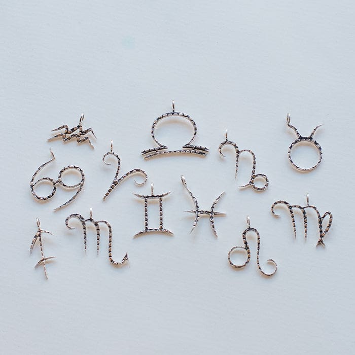 The sterling silver Zodiac Charm Collection from Love Is Project